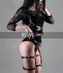 Sexy woman wearing black leather thigh harness with adjustable straps for BDSM play