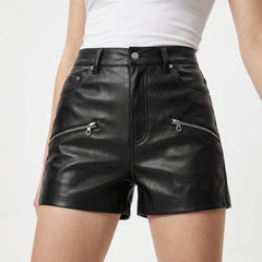 Close up of women’s black high waisted leather shorts with silver zipper pockets button fly and smooth finish - Rizwards Leather