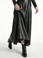 Close-up of black leather maxi dress hem with matching leather boots and flowing gothic outfit detail - Rizwards Leather