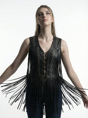 Woman wearing a black fringe leather vest on a white background