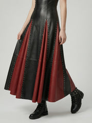 leather maxi dress skirt detail with red contrast panels and metal studs