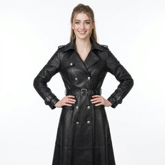 Woman wearing a black leather trench coat on a white background
