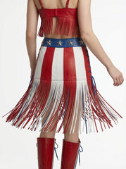 Red, white, and blue fringe dress with star accents on a plain background