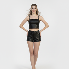 Women’s black leather co-ord outfit featuring a cropped tank top, high-waisted shorts, and glossy finish.
