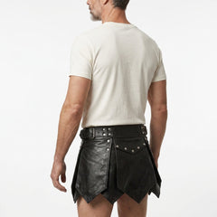 Back view of mens black leather kilt with pointed panels, buckle waist and handmade gothic Viking cosplay design - Rizwards Leather