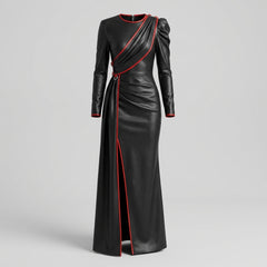 Product front view of black leather dress with red piping, asymmetrical draped front, long sleeves, fitted waist, and side slit - Rizwards Leather