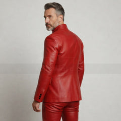 Man wearing a red leather jacket and pants on a plain background