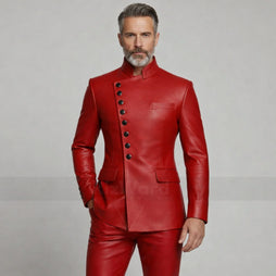 Man wearing a red leather suit with black buttons on a gray background