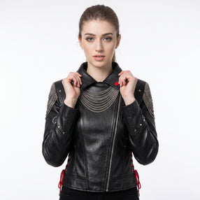 Women’s black leather gothic cyberpunk biker jacket back view with silver chain draping, studded rivets, and red lace-up details