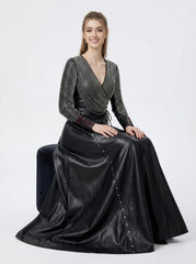 Women seated in black leather gothic maxi dress showing long sleeves, full skirt, and elegant leather fashion - Rizwards Leather