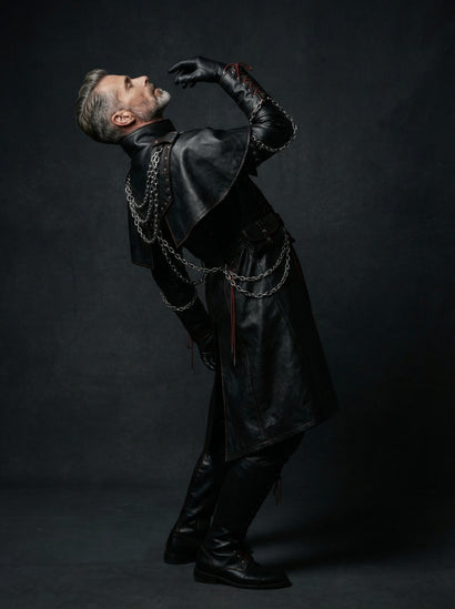 side View of Men’s Black Gothic Leather Long Coat Outfit | leather trench coat | Red Lace Up with Chains leather coat - Rizwards Leather