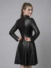 Side view of women’s black leather gothic dress with fitted bodice, long sleeves, and flared skater skirt