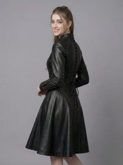 Back view of black leather gothic skater dress for women with high neck, long sleeves, and full flared skirt