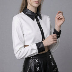 woman wearing black and white leather gothic two piece skirt set with crop top