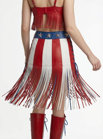 Woman wearing a patriotic dress with red, white, and blue colors on a white background