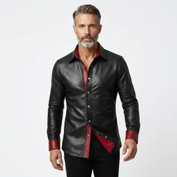 Men’s black leather shirt jacket with red lining, snap button front, and classic pointed collar.