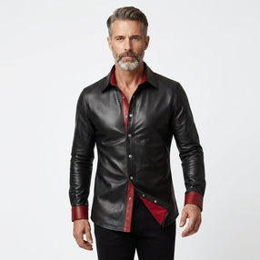 Men’s black leather shirt jacket with red lining, snap button front, and classic pointed collar.