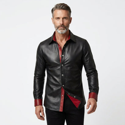 Men’s black leather shirt jacket with red lining, snap button front, and classic pointed collar.