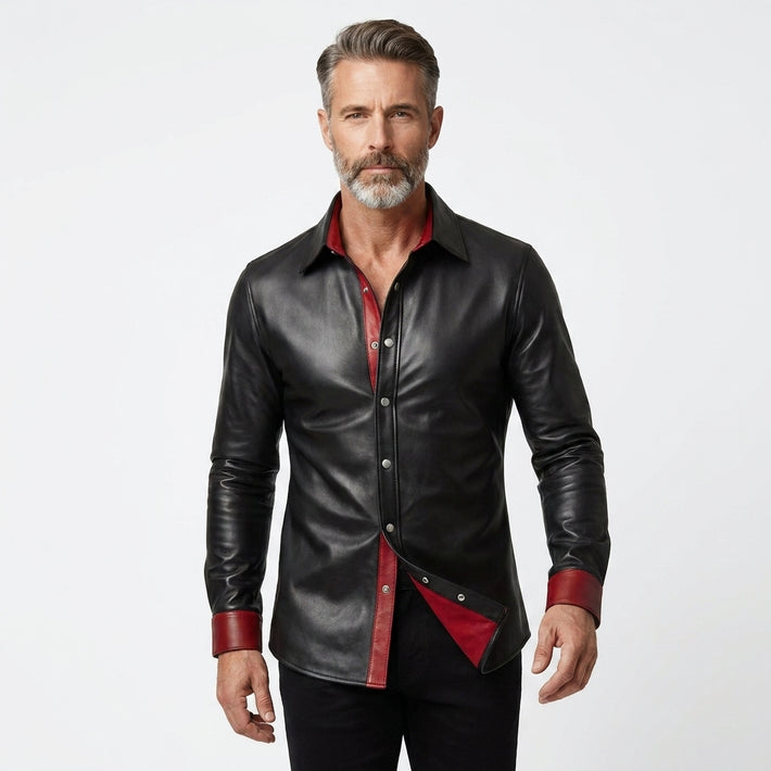 Men’s black leather shirt jacket with red lining, snap button front, and classic pointed collar.