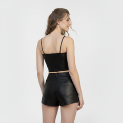 Stylish black leather shorts and crop top set with minimalist design, slim fit, and modern partywear look.