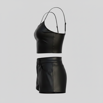 Women’s black leather shorts set with matching crop top, spaghetti straps, and sleek fitted silhouette.