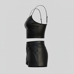 Women’s leather-look summer set with fitted crop top, mini shorts, waistband button, and front pocket details.