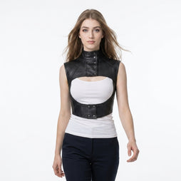 Women’s black leather cropped harness vest with high snap collar, open chest cutout, and structured gothic design.