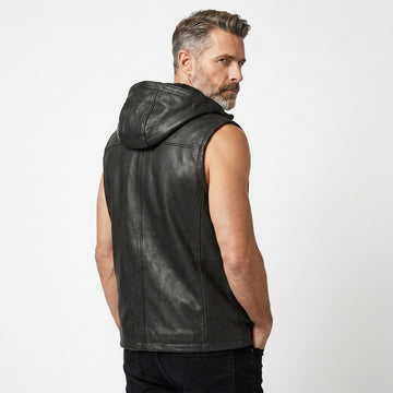 Men’s black leather sleeveless hoodie vest with front zipper, drawstring hood, and casual biker style.
