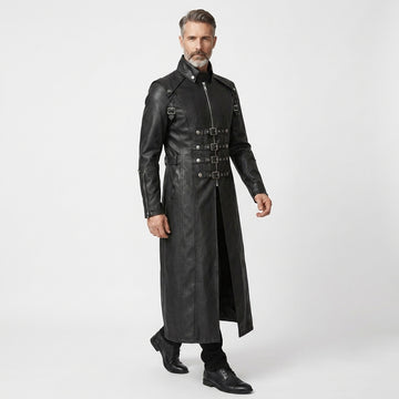 Man wearing a black leather gothic coat with silver buckles on a white background