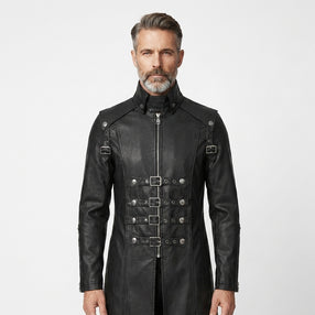 Man wearing a black leather gothic coat with silver buckles on a white background