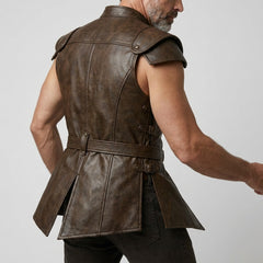 Man wearing a brown leather jerkin 
on a plain background