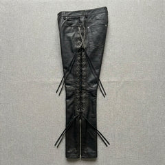 Back view of women’s black leather pants with pockets and gothic biker styling