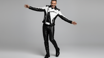 Men’s black and white asymmetrical leather biker jacket front view