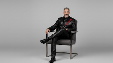 Men’s black leather blazer with red asymmetrical accent