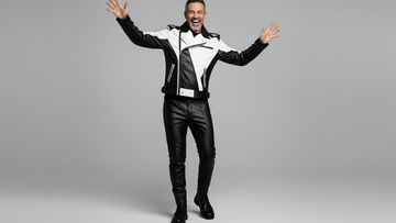 Men’s black and white asymmetrical leather biker jacket front view