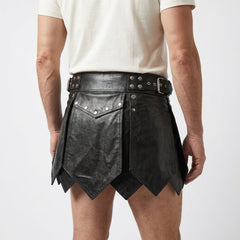 Close back view of black leather kilt for men with rivets, buckle belt, layered panels and gothic gladiator style - Rizwards Leather