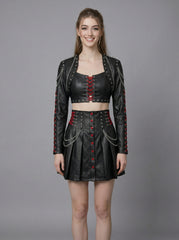 Front studio image of women’s black leather crop top skirt set with gothic bolero jacket, red corset lacing, pleated mini skirt, and chains
