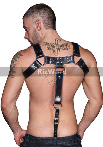 Male model wearing black leather bondage chest harness with chest straps.