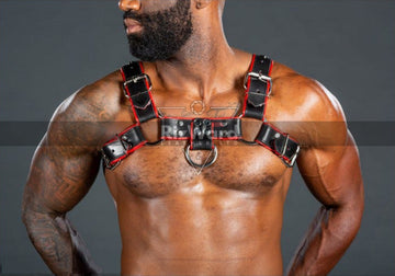 Model wearing a sleek BDSM leather harness-Step into dominant territory with this bondage chest harness built to impress. Pair it with our premium leather jockstrap for pure seduction.