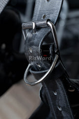 A closeup detailed buckle view-Crafted for those who crave full immersion, this BDSM leather harness delivers secure support and unapologetic style. Reinforced leather, steel rings, and padded shaping make this a must-have for advanced bondage play.