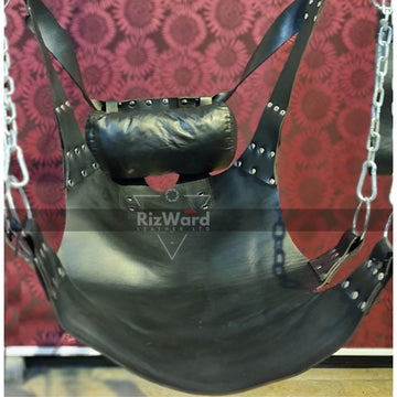 a person wearing a strait jacket and hood sitting on sex sling while opening his legs - sex sling and swing 